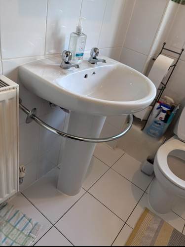 Bathroom sink, toilet and heated towel rail