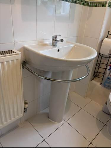 Bathroom sink installation with radiator
