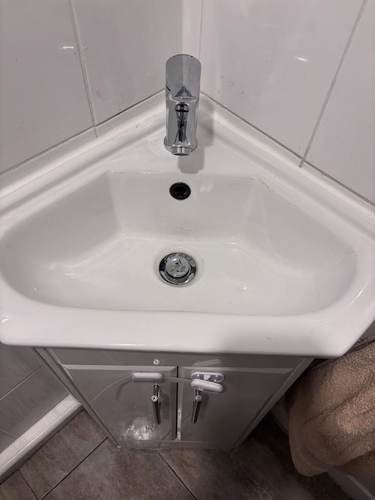 Corner bathroom sink installation
