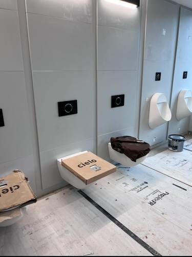 Commercial urinals mid-installation