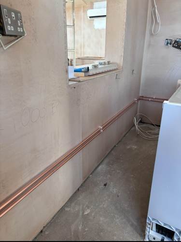 First-fix copper heating pipework in a new build
