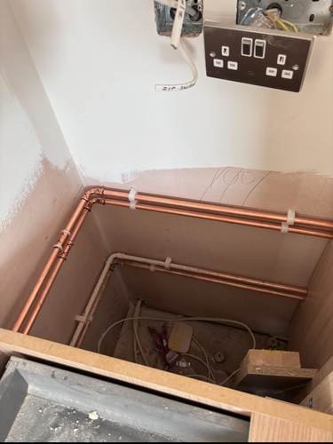 First-fix copper pipework in a wall cavity