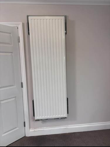 Radiator installed on a wall