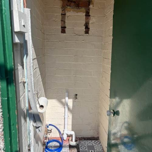 Heating pipework fitted in a riser cupboard