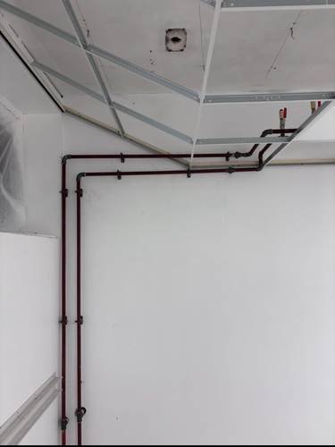 First-fix pipework loop fitted to a ceiling