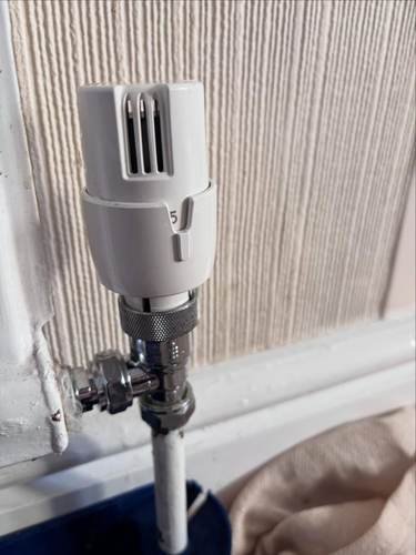 Thermostatic radiator valve being fitted