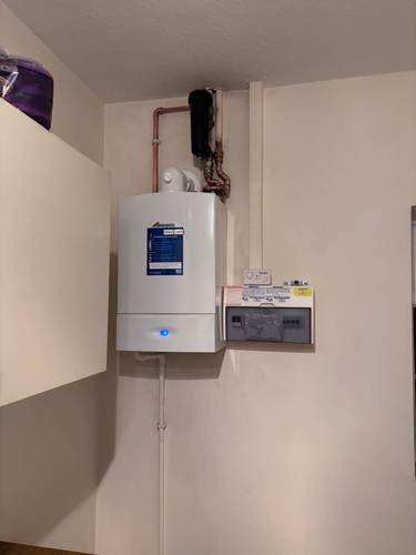 Combi boiler installed in a kitchen cupboard