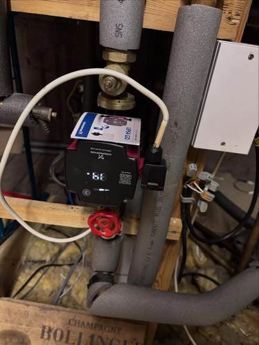 Pressure vessel and pump fitted as part of a heating first-fix