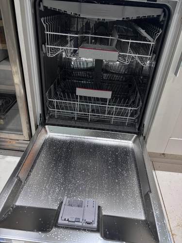Integrated dishwasher installed under kitchen worktop