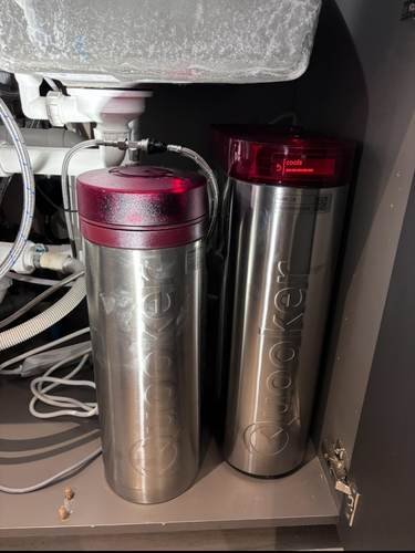 Twin-canister water filtration system fitted under a kitchen sink