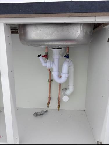 New push-fit pipework fitted under a kitchen sink
