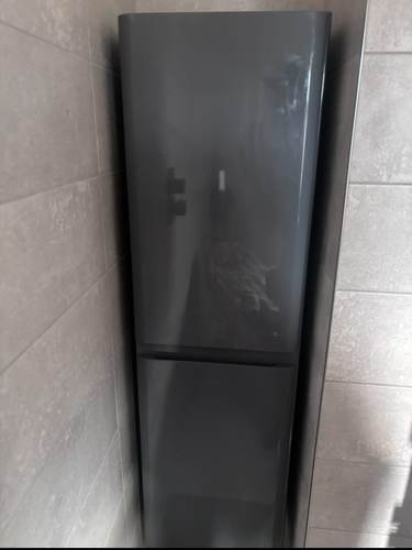 Integrated fridge freezer installed in a kitchen
