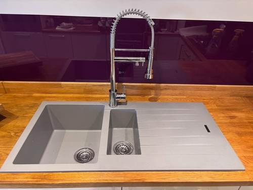 Kitchen sink with mixer tap and wood worktop